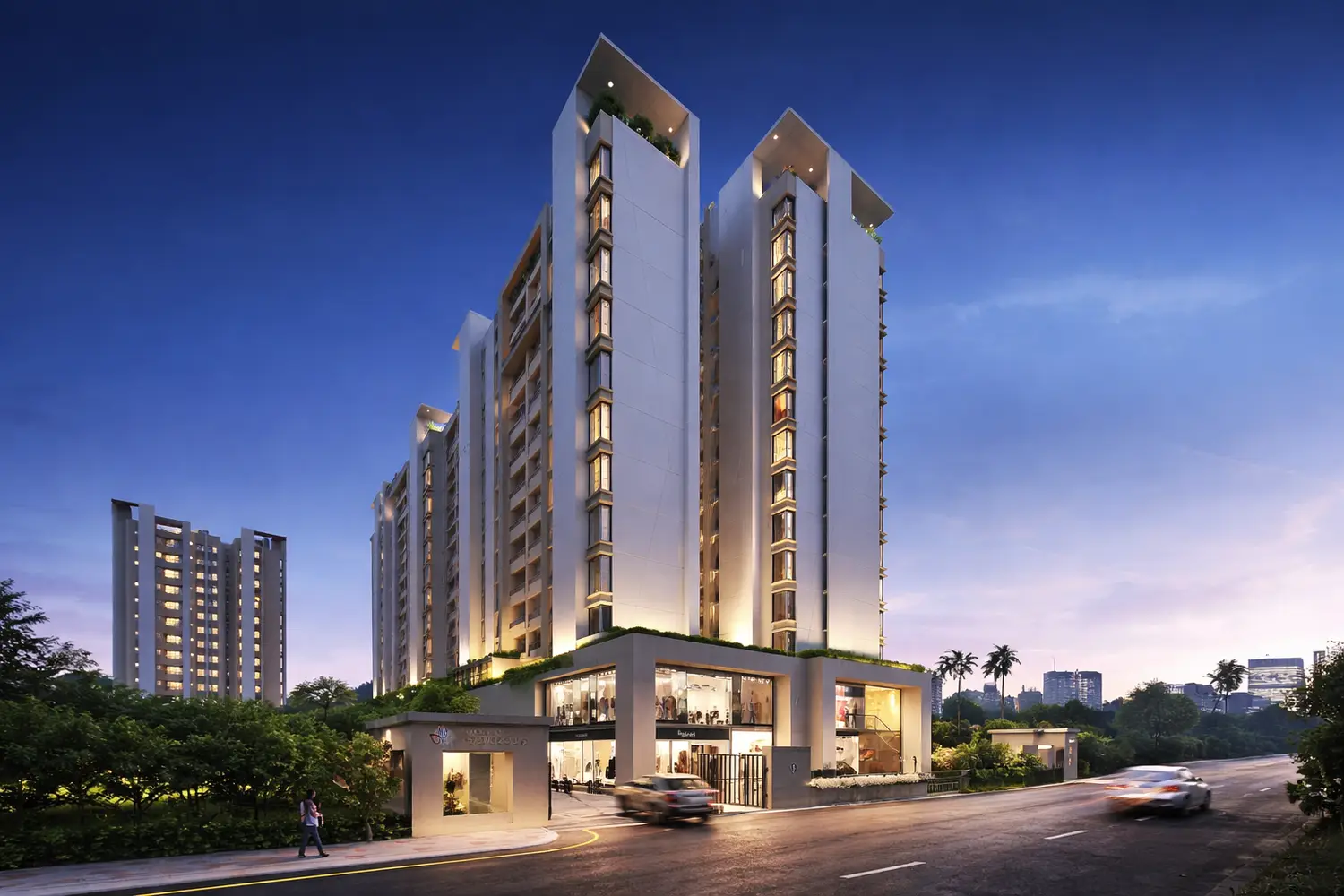 Ventoso premium residential project featuring modern high-rise towers with sleek contemporary architecture, illuminated balconies, landscaped podium level, and a welcoming street-facing entrance, showcased at dusk in an urban setting.