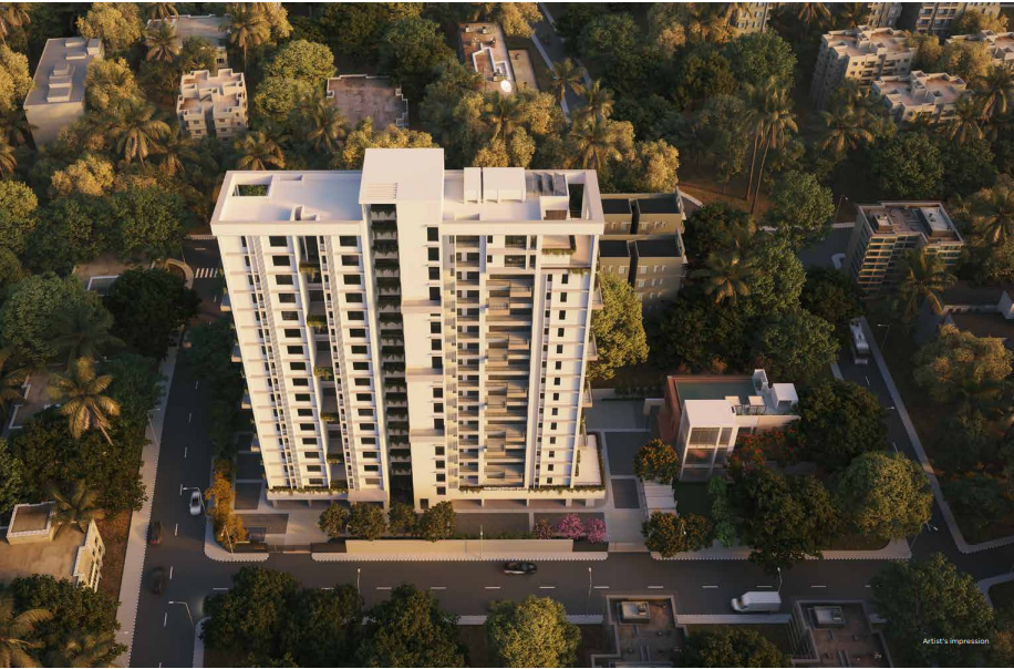 An aerial view of Primarc Aahana showcasing a modern high-rise residential tower with a clean white facade, surrounded by lush greenery and low-rise neighborhood buildings. The project is set along a well-planned road network with landscaped surroundings, offering a peaceful and well-connected urban living environment.