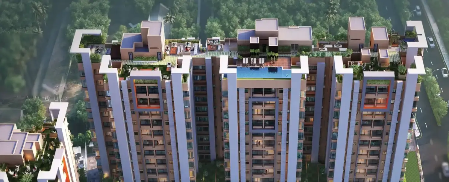 Aerial top view of the Ventoso residential project showcasing modern high-rise towers with rooftop amenities, landscaped terraces, a swimming pool, and surrounding green cover.